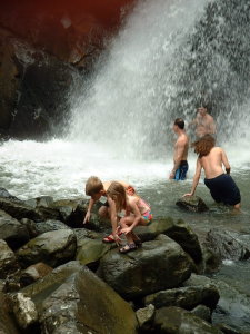 Kids in a waterfall